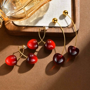 Polished cherry-shaped stainless steel earrings in bright, classic, and dark red colors
