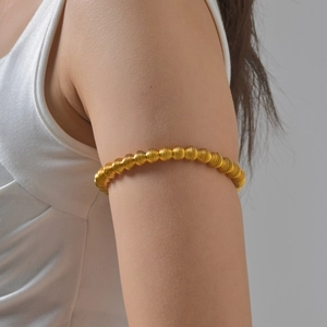 Unisex stainless steel spring telescopic armlet in gold finish for fashion styling