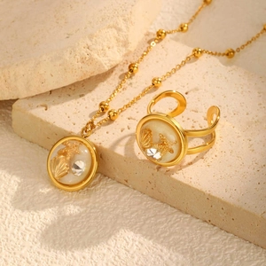 Gold ocean themed necklace and ring set with starfish shell charms and resin inlay