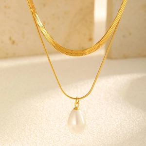 Gold double-layered necklace with herringbone chain and teardrop pearl pendant