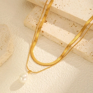 Double-layered gold stainless steel necklace with snake chain and white pearl pendant