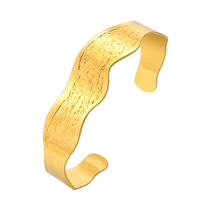 Polished gold wavy C-shaped open cuff bracelet with minimalist hammered texture