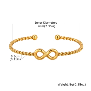 Detailed view of 18K gold infinity twist bangle with measurements and bead accents