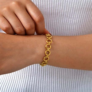 Minimalist gold linked chain bracelet for women with matte finish on model's wrist
