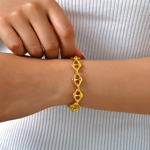 Minimalist gold geometric rhombus chain bracelet for women on a model wrist