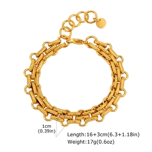 Detail of 1cm wide golden embossed strap bracelet with lobster clasp and extension chain