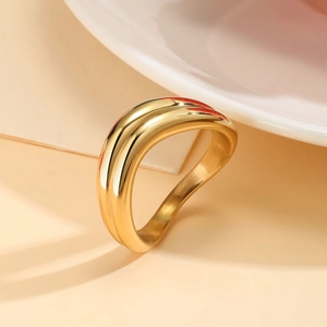 Minimalist double layer wavy 18K gold plated stainless steel ring shown on neutral background