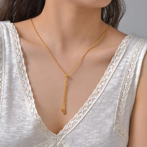 Collier minimaliste réglable en perles d'acier doré avec pendentifs à franges élégants