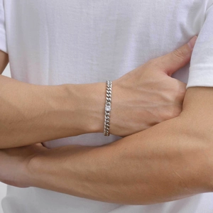 Men's silver cuban link bracelet with a sparkling round white zircon stone centerpiece