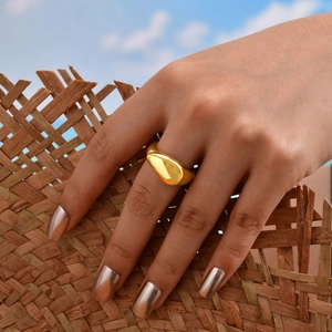 Polished 18K gold-plated stainless steel teardrop ring worn by model outdoors