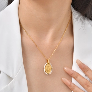 Gold stainless steel Virgin Mary oval pendant necklace with pearl border on model