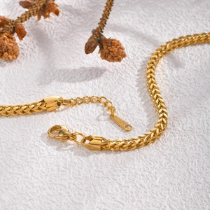 Detail of gold Spiga chain stainless steel bracelet with lobster clasp and extender