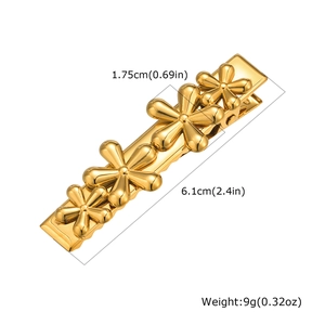 Macro detail of gold flower hair clip showing dimensions 6.1cm length and 1.75cm width