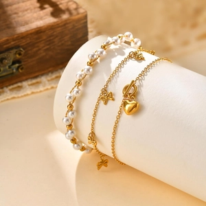 Ensemble de 3 bracelets dorés 18K élégants avec perles, nœud, pendentif cœur et fermoir OT