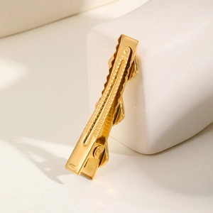 Detailed close-up of gold-plated stainless steel flower hair clip with anti-slip grip