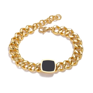 Golden chunky chain bracelet featuring a black square enamel charm and adjustable lobster clasp