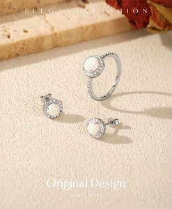 Macro shot of S925 silver jewelry set with opal stones and pavé zircons on stone