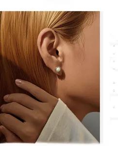 Close-up of elegant S925 silver stud earrings with opal stone and diamond halo