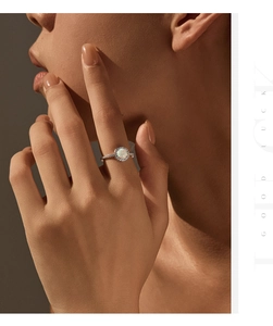 Close-up of elegant S925 silver ring with iridescent opal and sparkling side stones