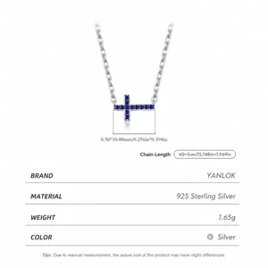 S925 sterling silver cross necklace with blue zircon stones on a white background