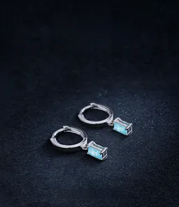Detailed shot of S925 silver hoop earrings with rectangular light blue tourmaline