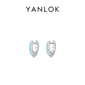S925 sterling silver hoop earrings featuring small turquoise gemstones on a white background