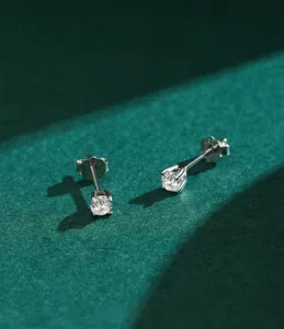 Macro shot of S925 sterling silver moissanite stud earrings with a brilliant round cut