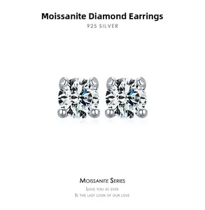 Macro detail of D-color moissanite stud earrings in a classic four-prong 925 silver setting