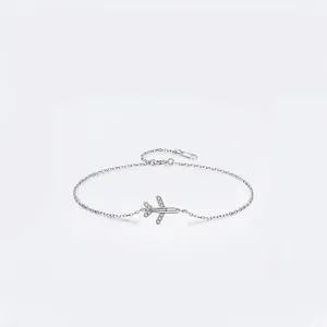 Minimalist S925 sterling silver airplane bracelet with sparkling zircon wings on white background