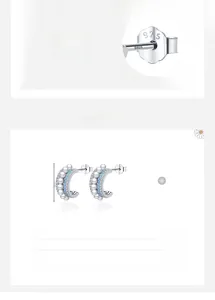 Gros plan détaillé de boucles d'oreilles en argent 925 avec perles et pierres bleues