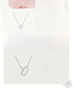 Detail of 925 sterling silver clavicle necklace with pavé cz double ring pendant