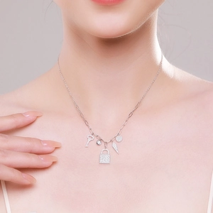 S925 sterling silver necklace with five charms including lock, key and feather for women