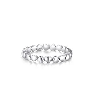 Minimalist S925 sterling silver ring with connected 3D heart shapes and polished finish