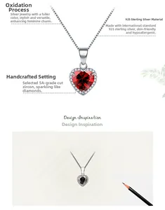 Détail du pendentif cœur en argent S925 avec zircon rouge et incrustation manuelle