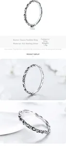 Détail macro d'une bague en argent 925 montrant le relief de vigne et le poinçon S925