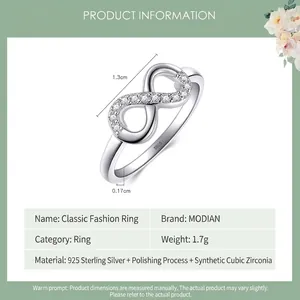 Polished S925 sterling silver infinity ring featuring white cubic zirconia accents