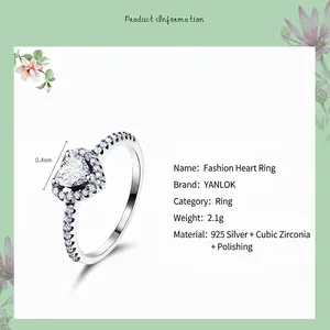 Elegant 925 sterling silver heart-shaped ring with pavé cubic zirconia on white background