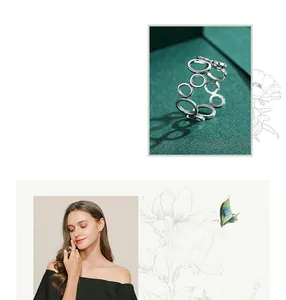 Detail of s925 sterling silver geometric hollow circle ring with modern cutout design