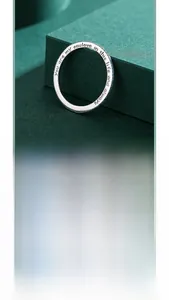 Detail of engraved 925 silver ring with turquoise stones and inner love message