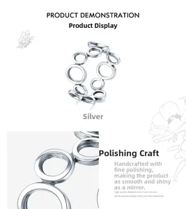 Macro detail of S925 sterling silver ring showing interlocking circles and high-polish finish