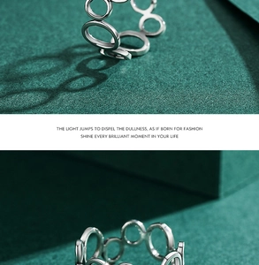 Detailed close-up of hollow silver rings with minimalist and geometric design