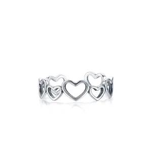 Minimalist S925 sterling silver ring featuring an elegant hollow heart pattern design