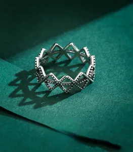 Macro shot of vintage 925 sterling silver geometric hollow ring with beaded edges