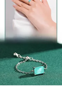 Macro detail of adjustable S925 silver chain ring with rectangular turquoise stone
