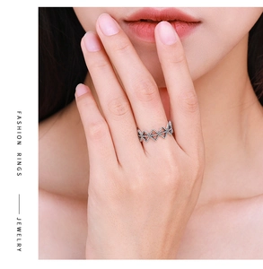 Detail view of 925 sterling silver geometric X-shaped ring with vintage textured finish