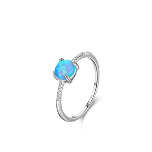 Bague élégante en argent sterling S925 avec opale bleue ronde et accents de diamant