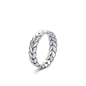 Retro 925 sterling silver leaf ring with zircon stones on a clean white background