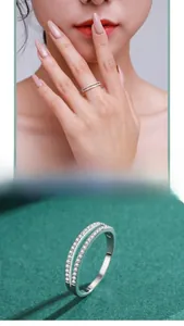 Close-up of double-row S925 sterling silver ring with sparkling round-cut cubic zirconia