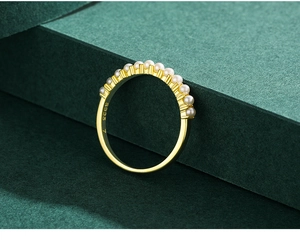 Detailed close-up of S925 sterling silver pearl ring with elegant gold plating