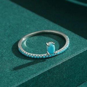 Elegant S925 sterling silver ring featuring a turquoise oval center stone and beaded band